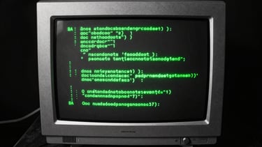 Overhead flat lay of a vintage CRT monitor displaying glowing green source code, high contrast, brutalist digital photography, harsh direct flash.