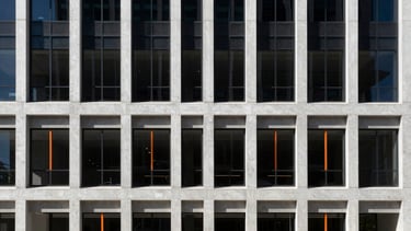 High-contrast architectural photography of a modern concrete and glass corporate center in West Jordan, sharp shadows, bright natural afternoon sunlight, minimalist composition, 35mm