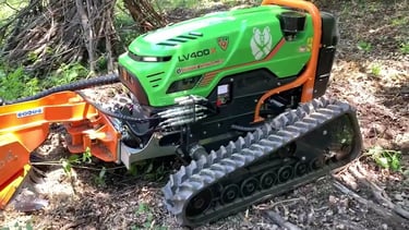 Green Climber LV 400 X Model in forested area with attachment doing work