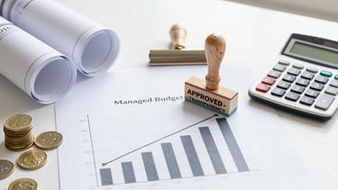 Close-up of skilled hands shaping wood with precision tools.