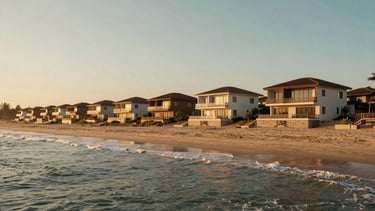 Wide panoramic shot of modern coastal villas at golden hour along Mandarmani beach, soft ocean waves, warm sunlight, 35mm lens