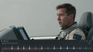 Widescreen digital animatic interface showing a sci-fi cockpit sequence, rough pencil sketch of a pilot looking alarmed, timeline with keyframe markers visible below, neutral grey background.