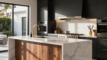 A high-end modern kitchen in a Los Angeles home featuring a massive white marble waterfall island, matte black cabinetry with warm wood accents, and luxury integrated appliances. The scene is bright with North American afternoon sun, highlighting gold hardware and sophisticated architecture.