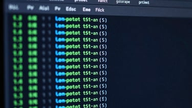 Close-up of a terminal interface displaying PowerShell execution results, green and cyan success indicators, dark high-contrast theme