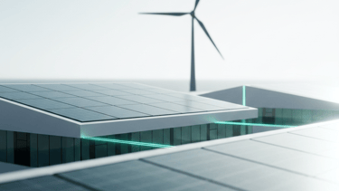 Modern eco-friendly building with rooftop solar panels and a wind turbine for renewable energy.