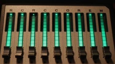 A close-up of a high-contrast soundboard with illuminated green levels in a dark studio