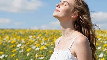 Technician adjusting a ventilation system in a bright, modern living room
