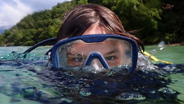 a woman in a diving mask and snorh snorg snorg