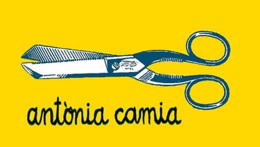 a pair of scissors and scissors on a yellow background