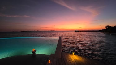 kudadoo maldives main pool sunset