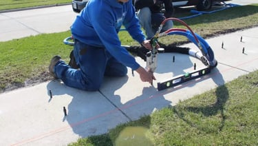 Concrete contractor leveling sidewalk in Warner Robins, GA