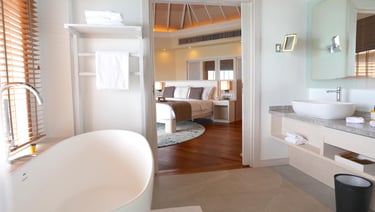 Baros Maldives overwater pool villa bathroom