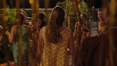a group of people standing around a table