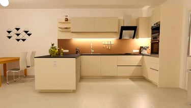 a kitchen with a table and chairs and a table