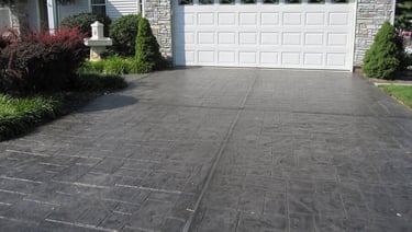 Dark gray stamped concrete driveway
