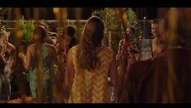 a group of people standing around a table