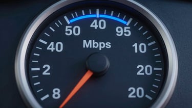 Isometric 3D render of a circular speed gauge with a bright blue arc indicator on a dark navy background, large bold numerals at center showing Mbps value, clean technical UI aesthetic, sharp edges, no text or labels
