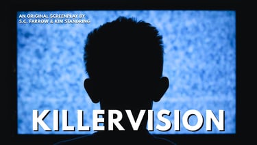 Silhouette of a man's head in front of a television screen showing blue static