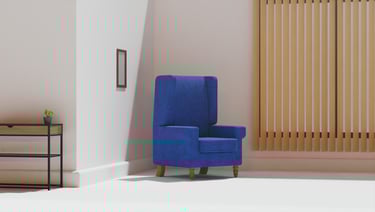 a blue chair in an almost empty room