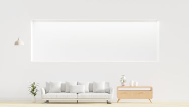 a white couch in a white room with a white couch