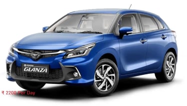 a blue toyota glanza suv parked in front of a white background
