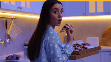 Woman sneaking in the middle of the night for some secret pizza
