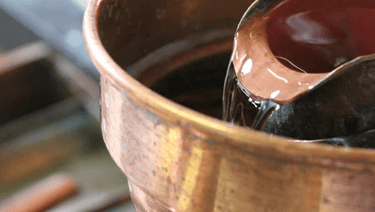 Eau de vie, qui coule dans l'alcoometre 