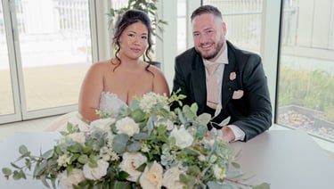 Bride and groom holding hands with wedding rings at Teesside wedding