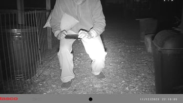 Martin taking a picture of the rat he shot.