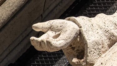 Close-up of St. Francis’s open hand, clearly displaying the stigmata wound, symbolizing passion.