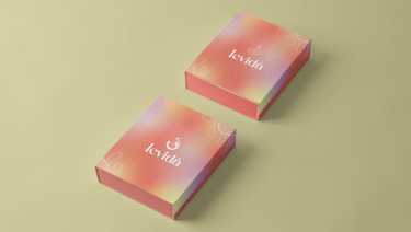 two boxes with a pink box on top of it