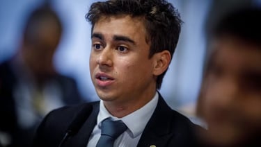 a man in a suit and tie with a microphone