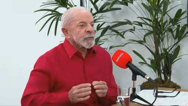 a man in a red shirt and microphone