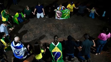 a group of people standing around a circle of flags
