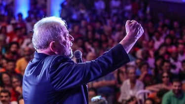 a man in a blue jacket and a microphone