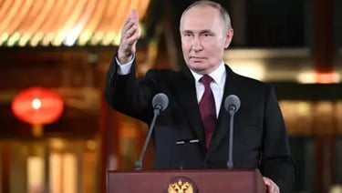 a man in a suit and tie is giving a speech