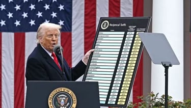 a man in a suit and tie standing at a podium with a microphone