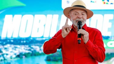 a man in a red suit and hat with a microphone