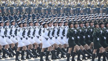 a group of women in uniform uniforms marching a parade