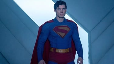 a man in a superman suit and a superman costume