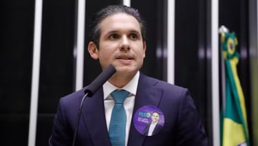 a man in a suit and tie with a microphone