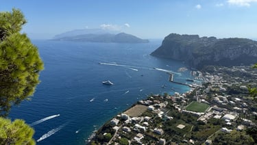 Scenic view from the Capri to Anacapri chair lift with blue water and landscape below