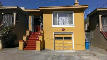 Vents and mail slot on garage door in San Francisco.
