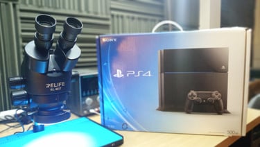 Microscopio Relife y caja de ps4