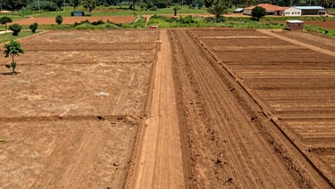 Aerial view of graded land in Miango Jos, Nigeria  under a cloudy sky.