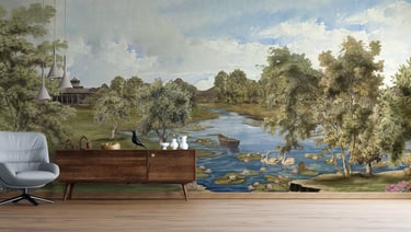 Vintage landscape mural featuring a river with swans behind a mid-century modern sideboard and armchair.