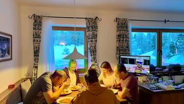 a group of people sitting around a table