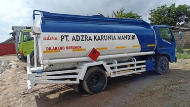 a truck with a blue and white tank top