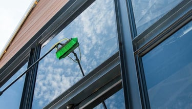 Professional high-rise window cleaning by TOT Cleaning & Landscape Sdn Bhd.