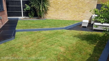 Corner Triangle Garden With Black & Grey Limestone Patio Sleeper Retaning Walls Multi-tier Level